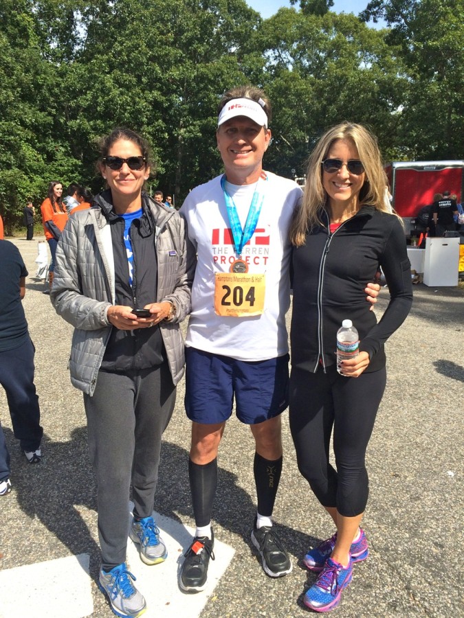 At the finish line, after four hours, forty-five minutes of running, with Hamptons Marathon race directors Amanda and Diane. They put on a world-class race!